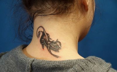 Что означает татуировка кота